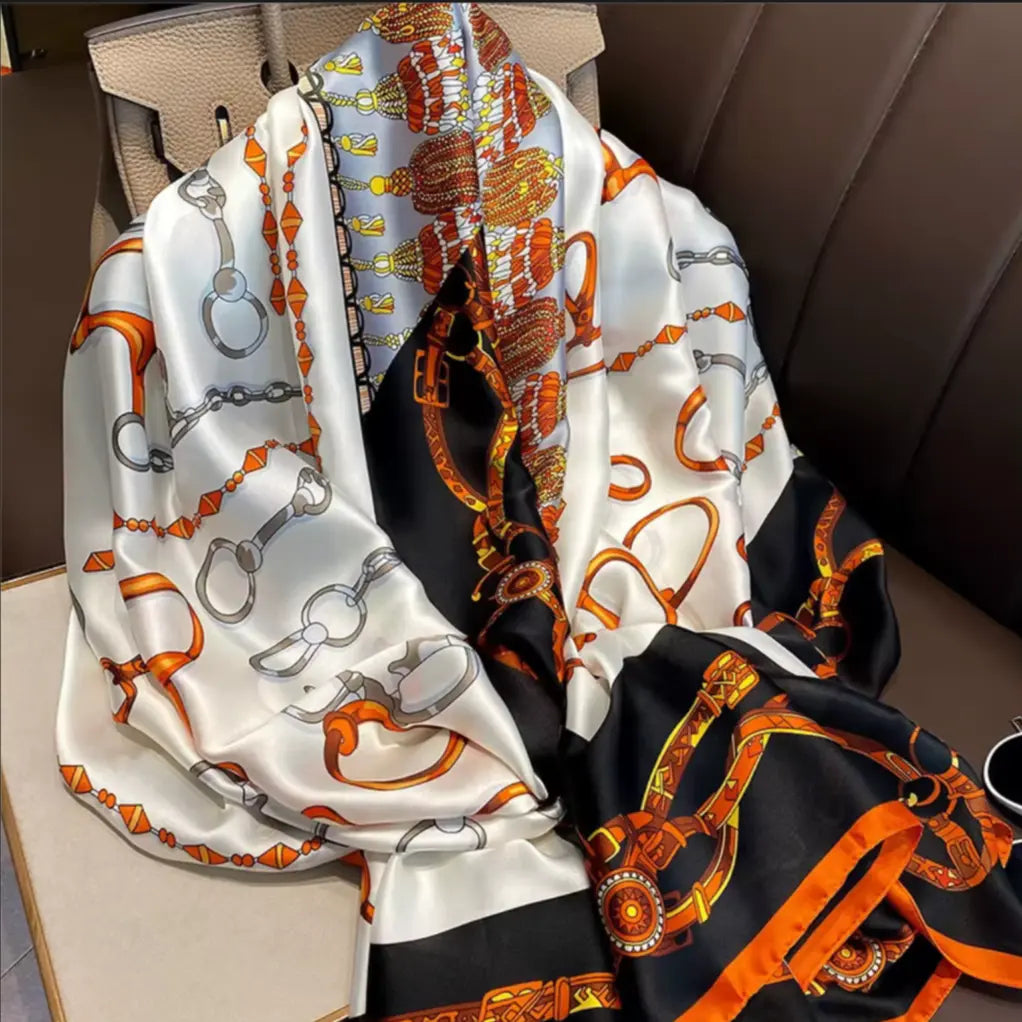 Silk scarf with intricate patterns on a chair