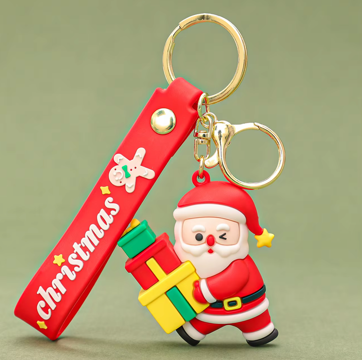 Keychain with Santa Claus design and 'Christmas' text on a green background