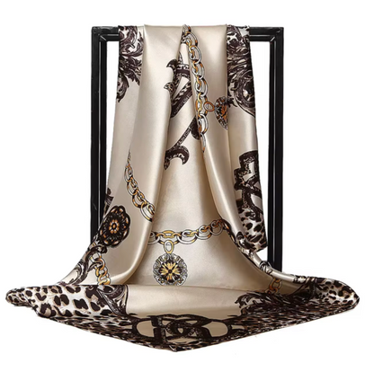 Decorative scarf with chain and leopard print pattern on a white background