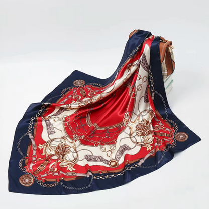 Decorative scarf with red, blue, and white pattern on a white background