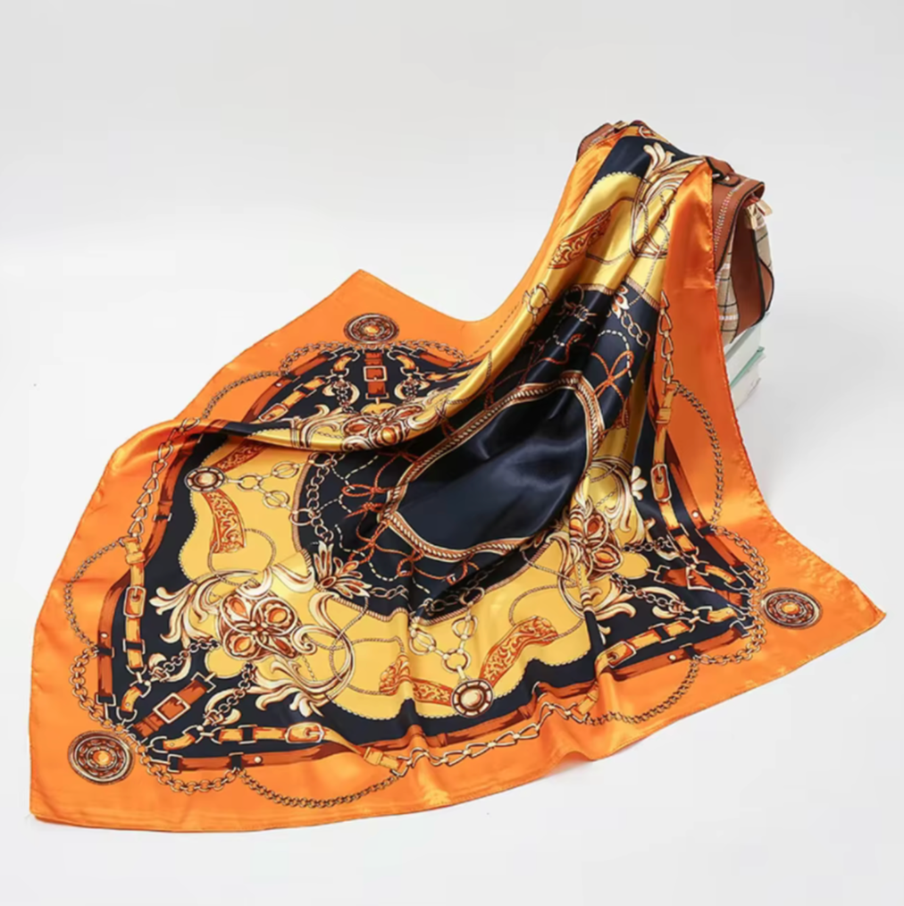 Decorative scarf with intricate patterns on a white background