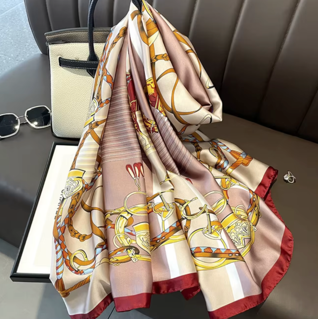 Decorative scarf with intricate patterns on a car seat